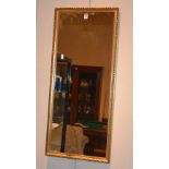 A modern gilt wall mirror,