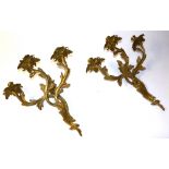 A pair of French brass wall sconces circa 19th century, each with three scroll branches,
