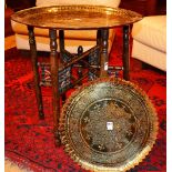 A binaries table, with brass oval tray top, 57cm high x 58cm diameter,