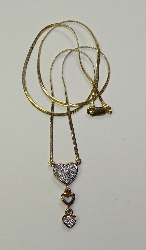 A 9ct gold and diamond heart motif pendant,