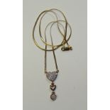 A 9ct gold and diamond heart motif pendant,