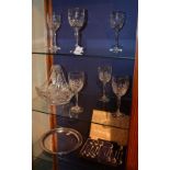 A set of six crystal wine glasses, raised on tapered stem and circular foot, 21cm high,