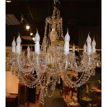 A crystal chandelier, with twelve scroll branches,