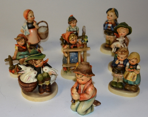 A collection of nine Hummel figures, marked W Goebel to base,