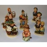 A collection of nine Hummel figures, marked W Goebel to base,