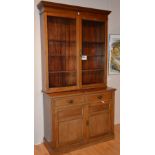 An Edwardian mahogany bookcase on cupboard chest,
