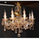 A crystal chandelier, with eight scroll branches,