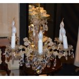 A crystal chandelier, with six scroll branches,