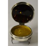 A silver and tortoiseshell circular trinket box, hallmarks for London 1921-22, with hinged top,