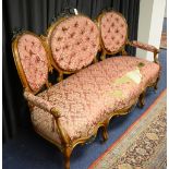 A late Victorian mahogany framed buttonback settee,