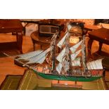 A painted wooden model of a Galleon circa 1940's, with masts, the hull painted in green,