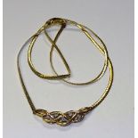 A 9ct gold and diamond necklace, the Celtic shaped motif to base set with five milidiamonds,