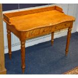 A late Victorian satinwood washstand, with two small drawers raised on spindle supports,