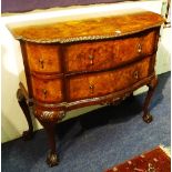 A Chippendale style walnut chest of drawers, with two drawers flanked by two small drawers,