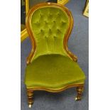 A Victorian lady's walnut armchair, upholstered in green buttonback velour,