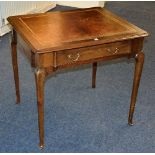 A vintage mahogany writing table, with later tooled leather inset to the top, above single drawer,