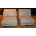 A pair of contemporary cream leather chairs,