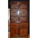 A George III mahogany bookcase on similar secretaire chest,