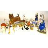 A selection of porcelain figures, to include Goebel and Hummel figures, Belleek vase,