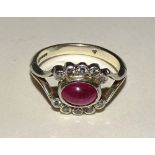 A 9ct white gold ruby and diamond ring,