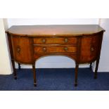 A reproduction sideboard, with two central drawers flanked by panelled door,