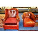 A vintage red leather armchair, raised on bun feet, with later cushion, 86cm high,