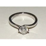 An 18ct white gold solitaire diamond ring, the single brilliant cut diamond measuring 0.