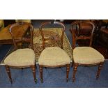 A set of six Victorian walnut dining chairs,