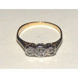 A gold three stone diamond ring,