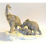 A Lladro figure group of a 'Family of Elephants',