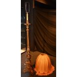 A gilt painted floor lamp with shade,