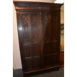 An oak Gothic style armoire in the Elizabethan manner, circa early 20th century,