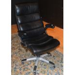 A modern black leather swivel office chair,