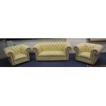 A Chesterfield club style leather sofa with pair of matching armchairs,