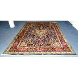 A Persian rug, decorated with large floral motif,