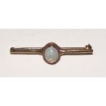 A 9ct gold opal bar brooch, stamped 375 to underside, 2.