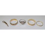 Two 9ct gold wedding bands, one with moulded foliate decoration, the other of ribbed formation,
