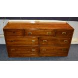 A campaign style sideboard manufactured by Ethan Allen, with central drawer flanked by small drawer,