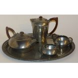 A Liberty & Co Tudric English pewter five piece teaset, of hammered form comprising of teapot,