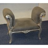 A reproduction silver painted window seat, upholstered in grey fabric,