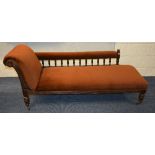 An oak framed chaise longue circa early 20th century, upholstered in brown velour,