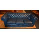 A blue leather buttonback club Chesterfield style three seater sofa,