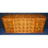 WITHDRAWN - A walnut and oyster inlaid sideboard, with four long drawers to the centre,