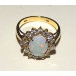 An 18ct gold opal and diamond ring,