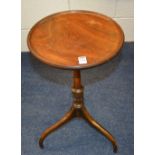 A 19th century mahogany wine table, raised on shaped tripod supports,