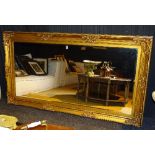 A reproduction Victorian style gilded overmantle mirror,