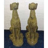 A pair of composite stoneware seated dogs,