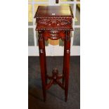A reproduction hardwood plant stand,