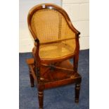 A Victorian mahogany bergere child's chair, raised on table support,