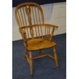 A 19th century ash and elm Windsor armchair, with pierced splat and spindle supports,